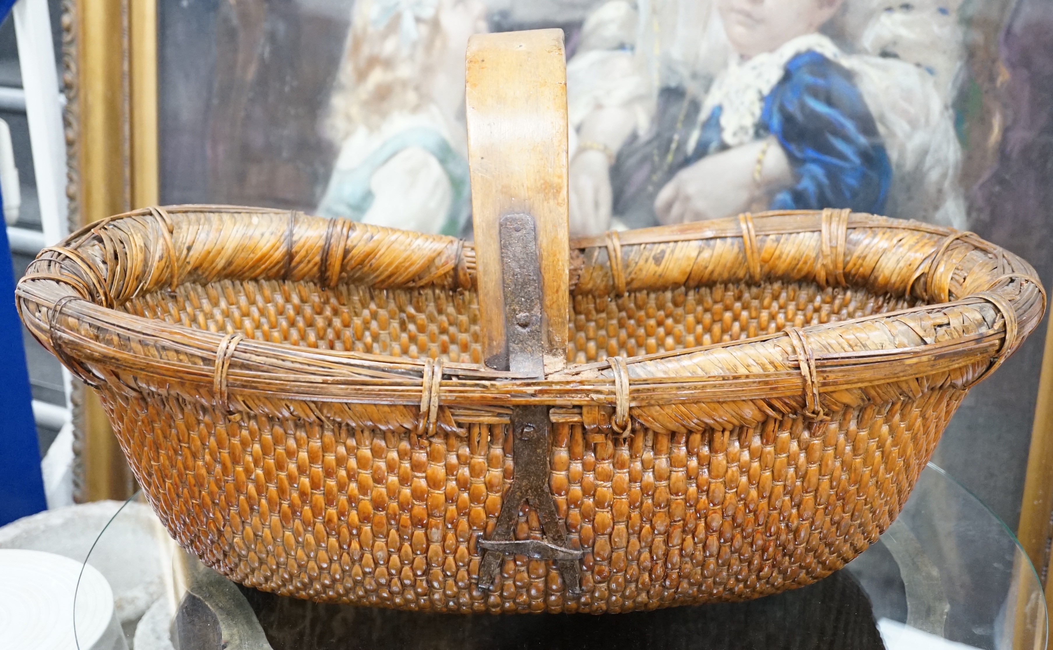 A brass mounted Chinese wicker trug basket. 67cm long